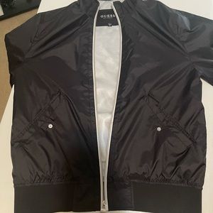 Guess wind breaker . Black & silver tone .